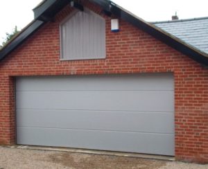 our winning photo showing her installed Carteck Solid Smooth White Aluminium insulated sectional door.