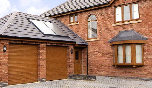 Picture of a pair of Aluroll roller shutter garage doors in Golden Oak