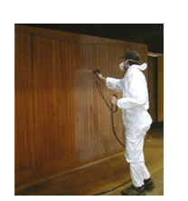 Picture showing method of spray finishing a Cedar garage door