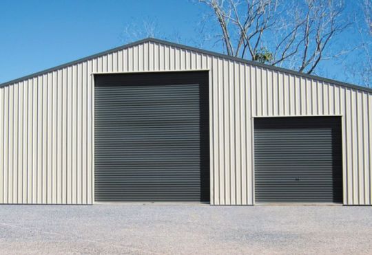 A large  and a small Gliderol light industrial doors fitted on an industrial unit.