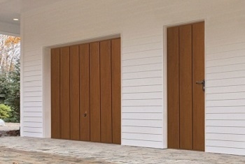 Hormann Wide Vertical-Rib Up & Over garage door in Golden Oak with matching side door