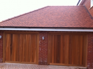 E: Woodrite Chalfont up and over timber doors in cedar