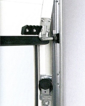 Side tension spring assembly on smaller doors