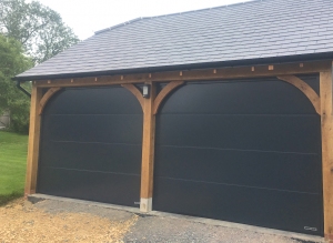 D: A pair of Hormann LPU42 sectional doors in large rib in Anthracite Grey silkgrain finish
