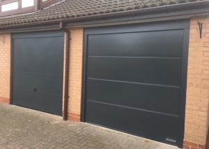 D: Hormann LPU42 insulated sectional in L rib and Garador Design 100 up & over doors in Anthracite Grey