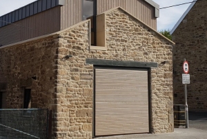 H1: Hormann N500 style 405 open for infill up and over garage door, clad in pre-coated cedar, project partly funded by European Fund for Rural Development