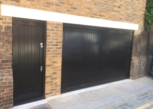 H1: Woodrite Barnham up and over garage door and personnel door in accoya in Black 70% gloss finish as stipulated by RBKC
