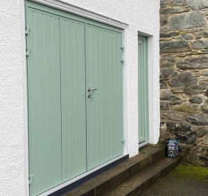 A. Ryterna Rib insulated side hinged door with a side door