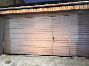Z1: Ryterna Insulated sectional door in Basalt Grey (RAL 7012) with a wicket