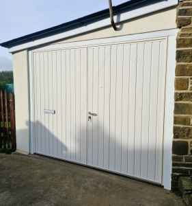C2: Carteck isulated side hinged, vertical rib with factory fitted letter box & spy hole