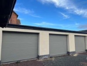 W1: 3 Hormann LPU42 insulated sectional garage doors in Window Grey, large Rib with woodgrain surface finish
